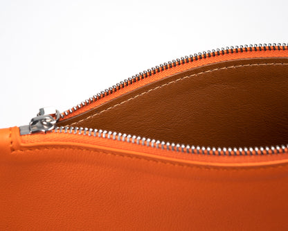 Orange leather city pouch