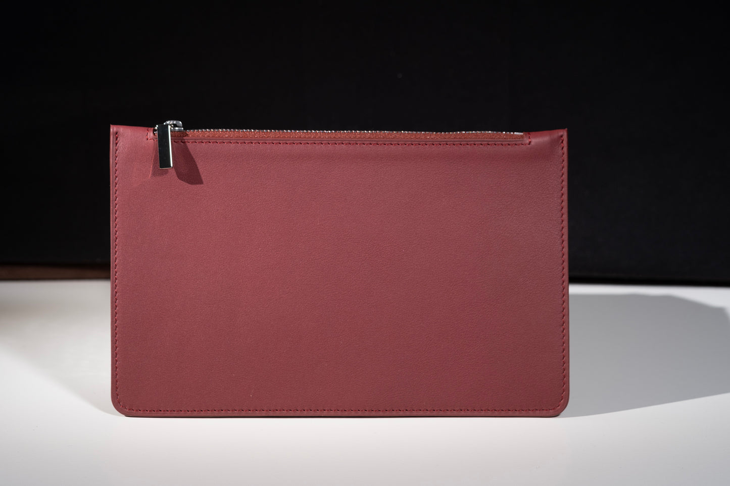 City clutch bag in burgundy leather